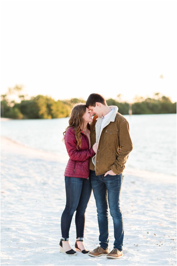 this is a picture of a couple wearing coats at davis island 