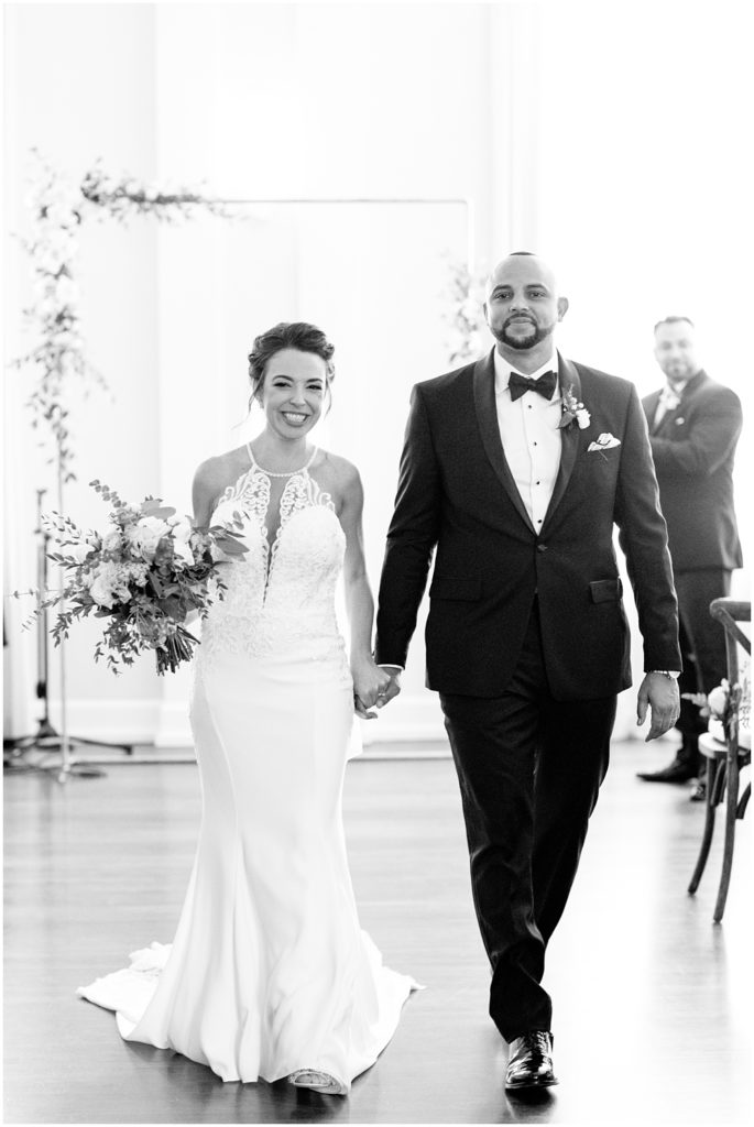 Bride and Groom walking out of ceremony at Orlo in Tampa Florida