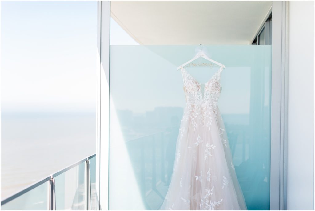 Wedding dress hanging on wall at opal sands