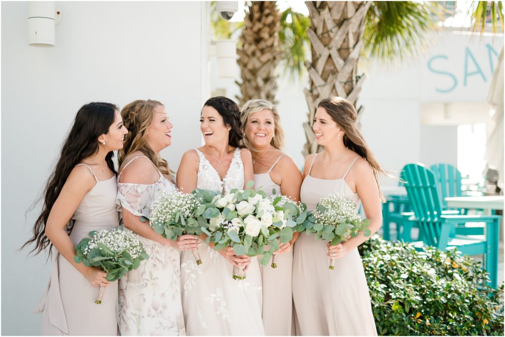 bridesmaids laughing at Sandbar at Opal Sands