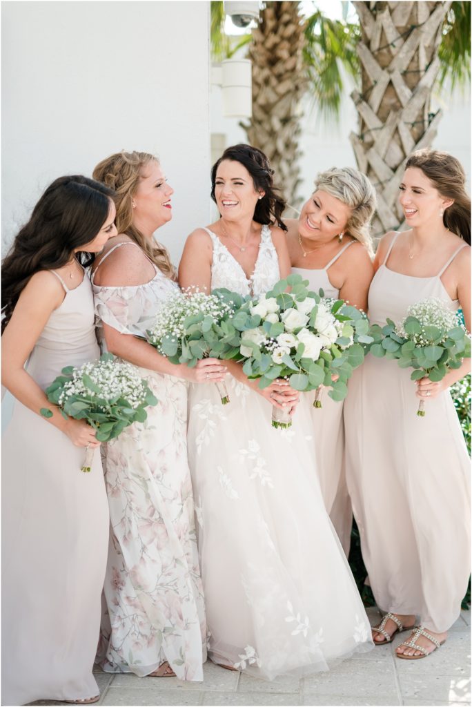bridesmaids with white flowers at clearwater beach