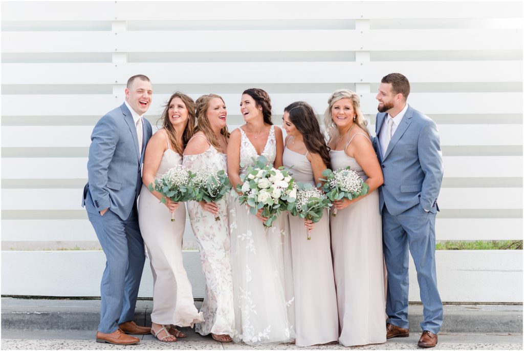 bridal party laughing at Opal Sands