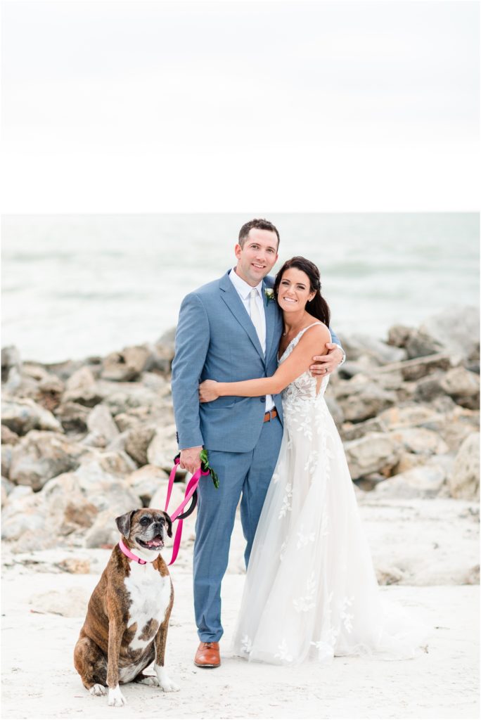 bride and groom with dog at clearwater beach