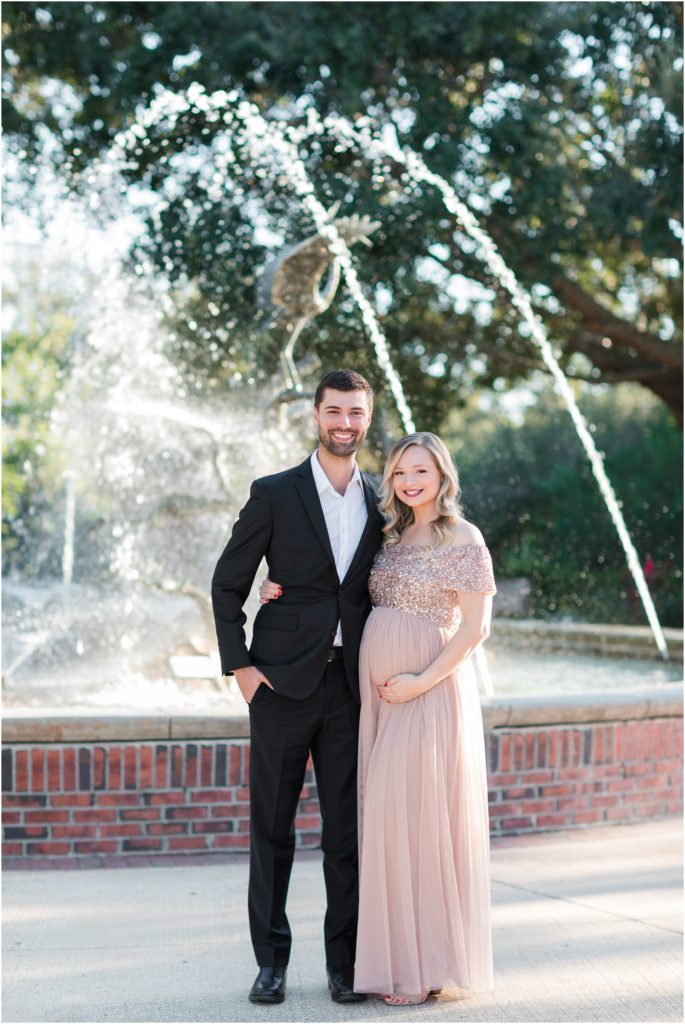 Couple standing in front of fountain in safety harbor florida