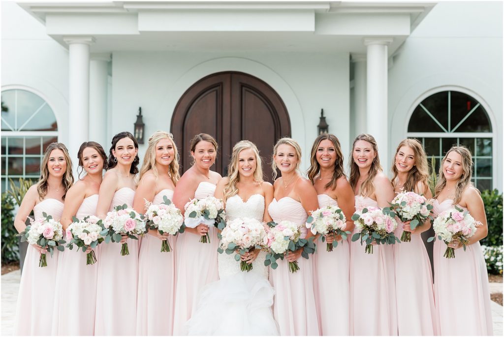 bridesmaids in blush dresses at Harborside chapel
