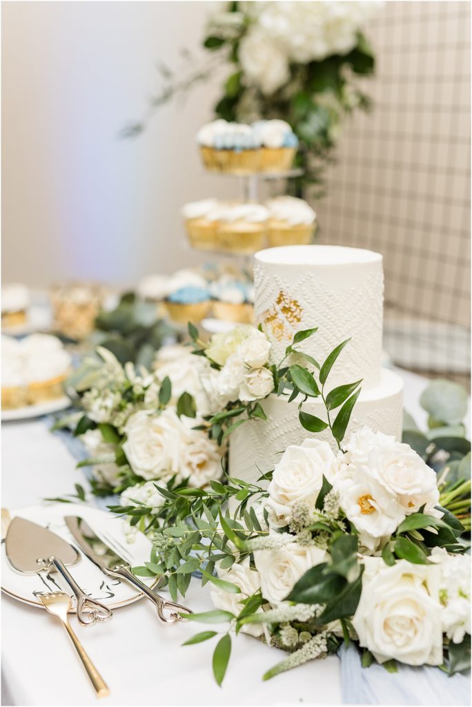 wedding cake with white florals at reception