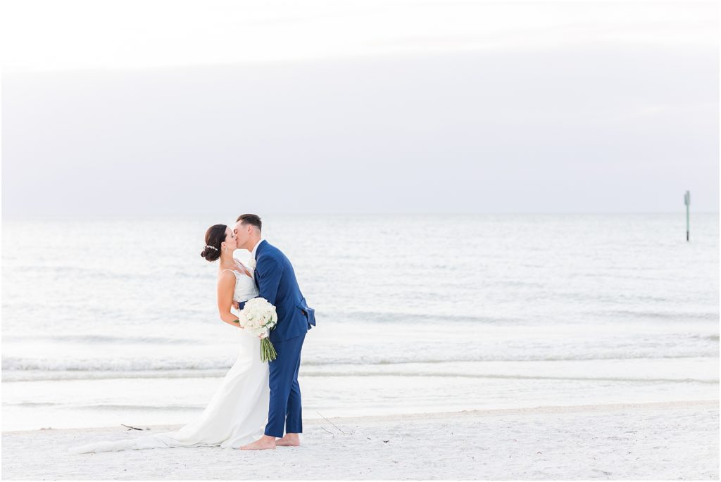 bride and groom kissing at sandpearl clearwater wedding
