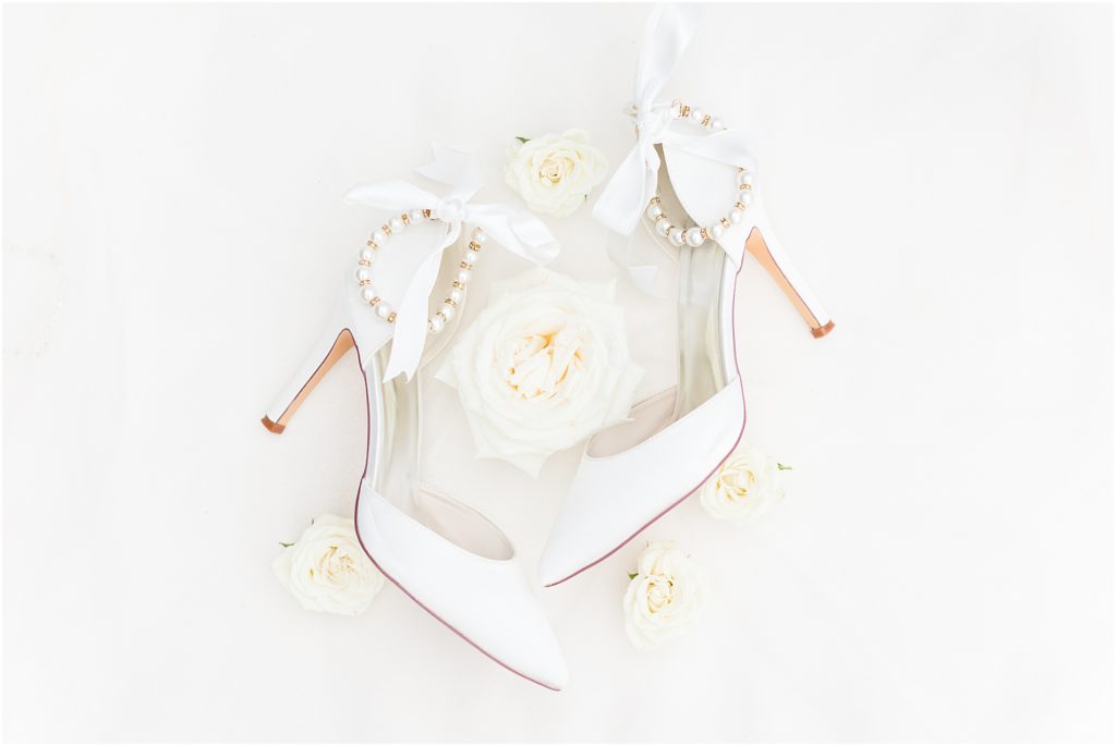 white high heel shoes with pearls 