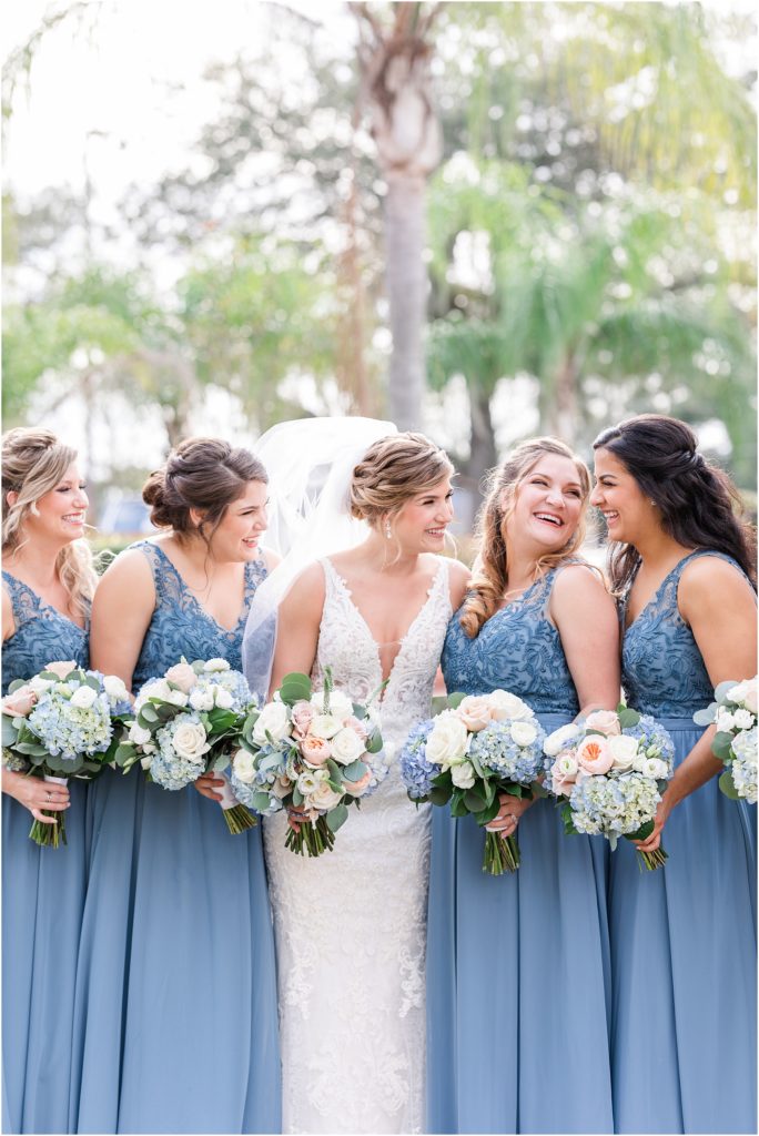 bridesmaids wearing slate blue dresses