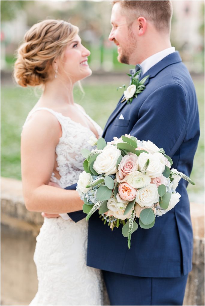 navy blue groomsmen suit and white floral boutonniere 