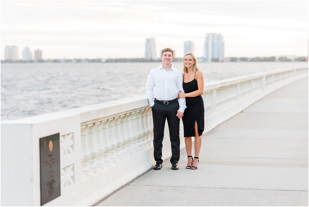 bride and groom smiling on bayshore blvd in tampa