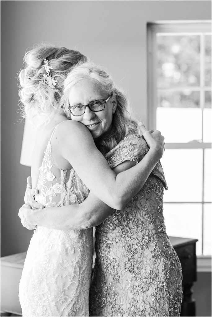 mom hugging daughter at pittsburgh wedding