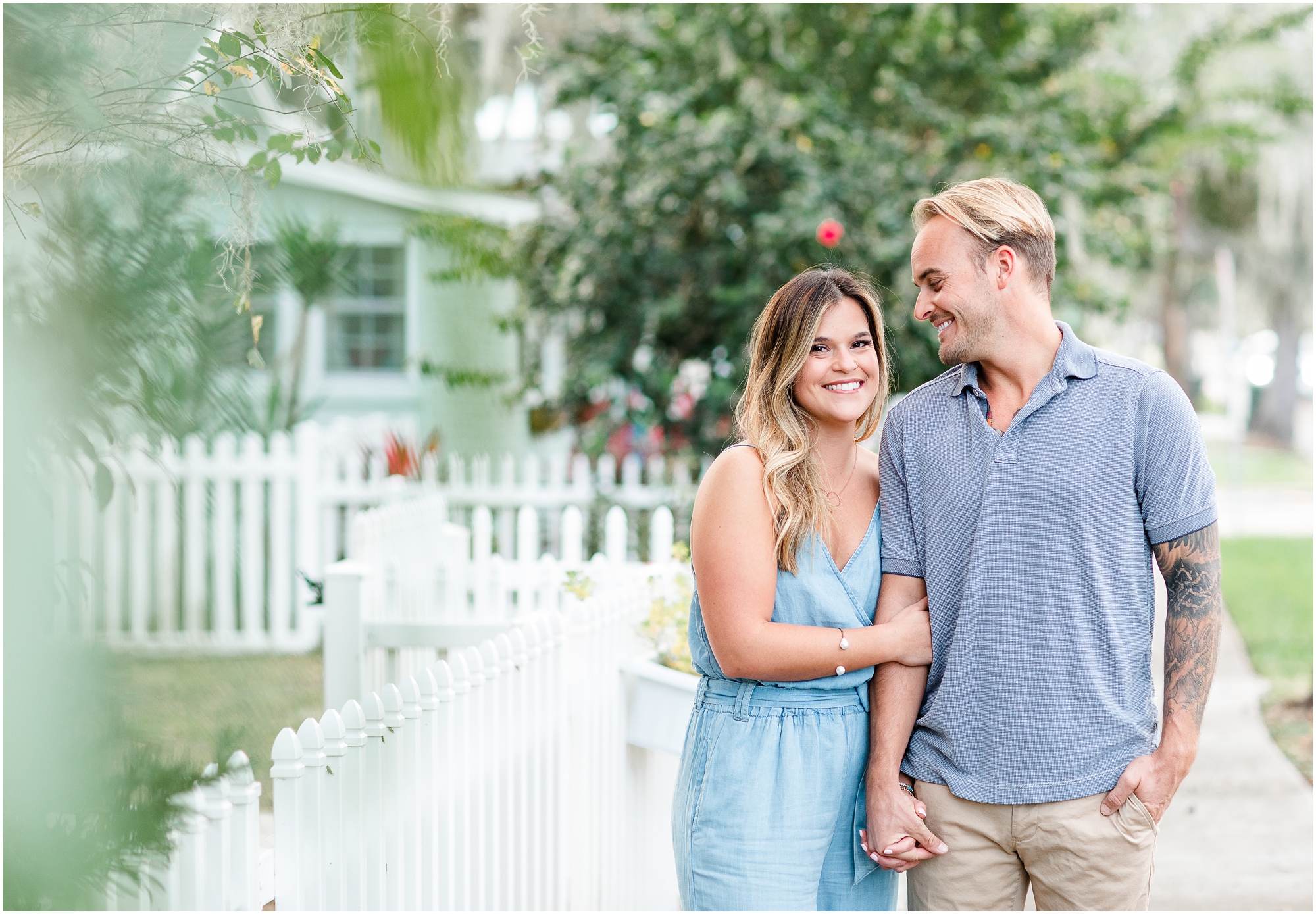 This is a photo holding hands at downtown safety harbor engagement session